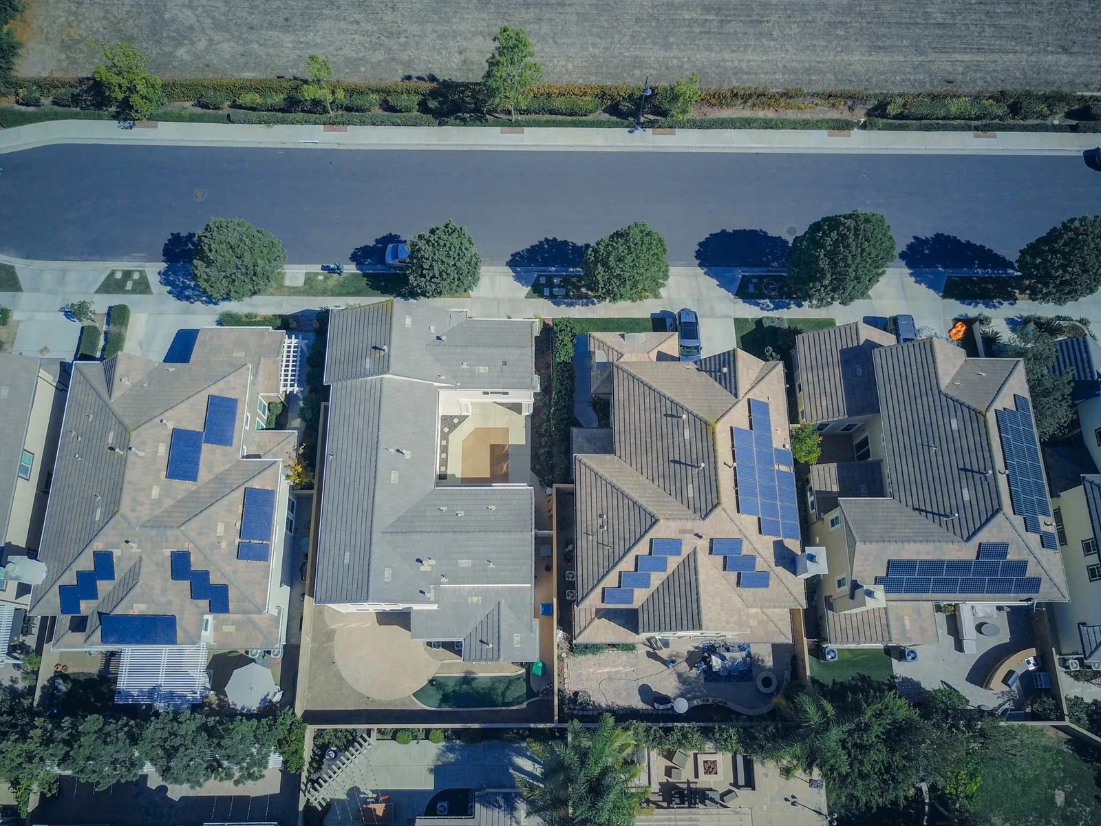 Aerial view of a neighborhood with rooftops mapped for solar potential